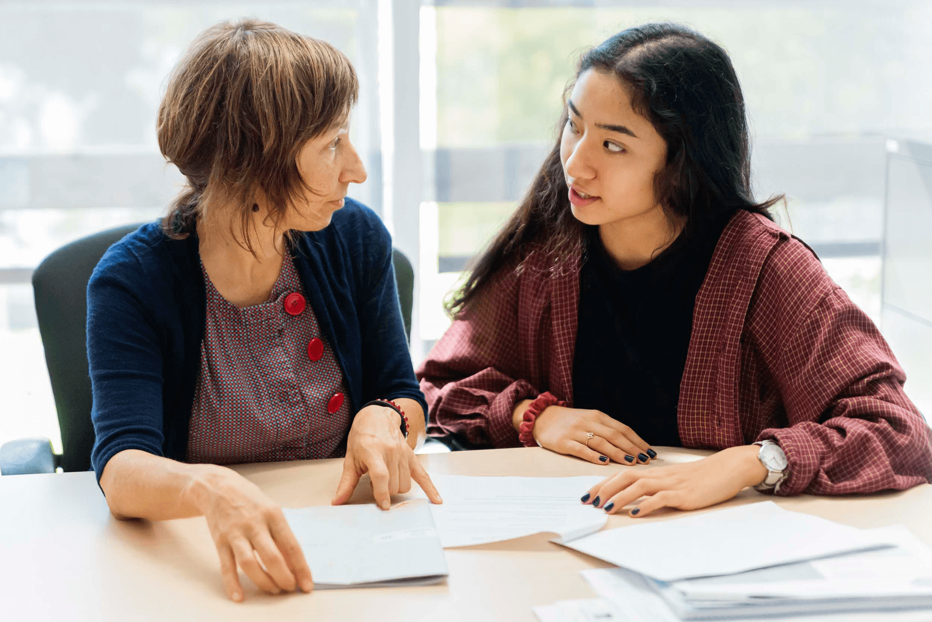 female student meeting with a counselor