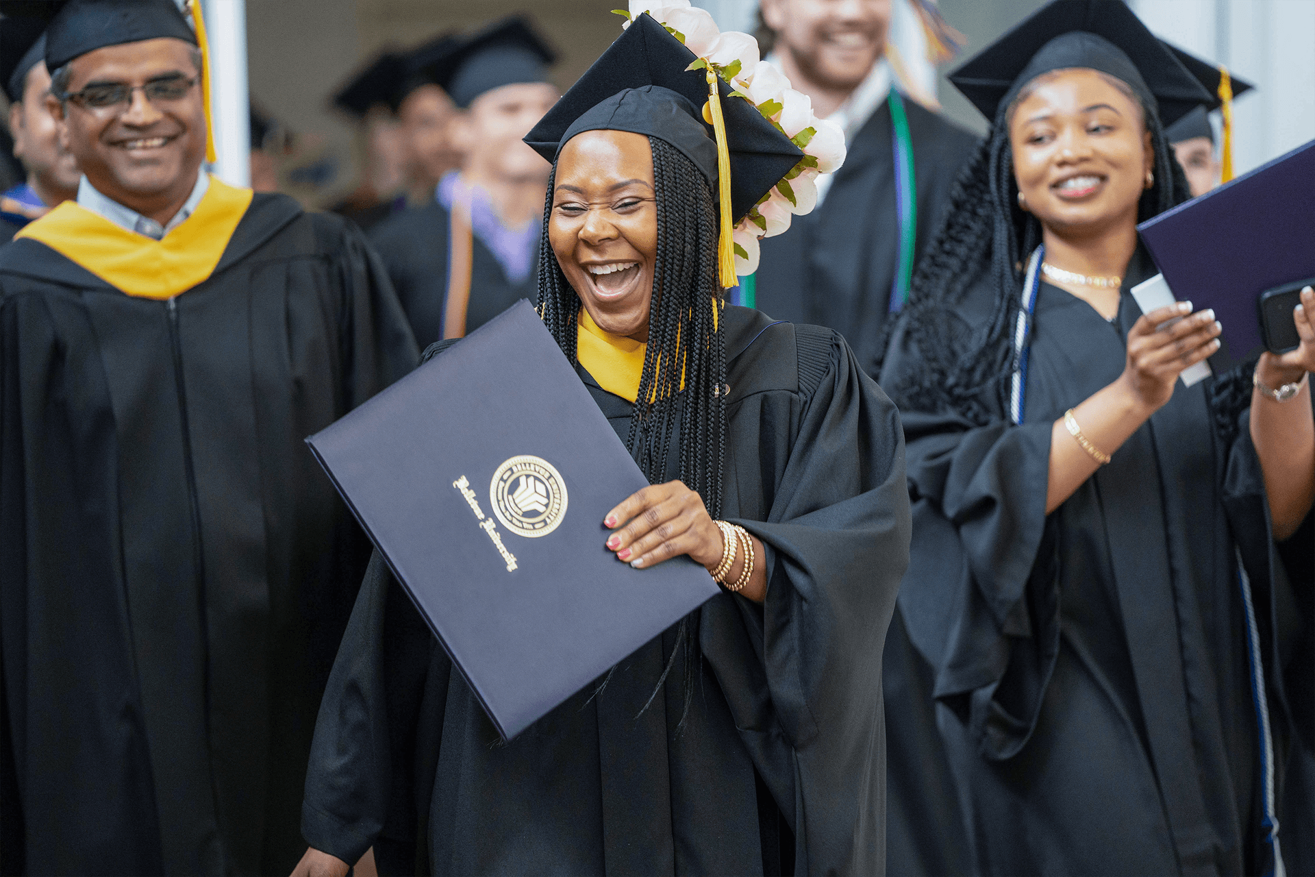 woman with college diploma at graduation