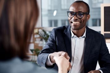 Two business people meeting and shaking hands