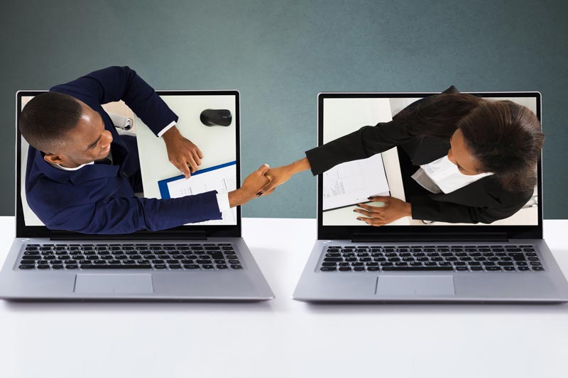 Two business people meeting and shaking hands